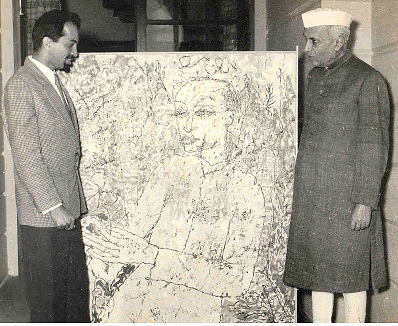 Laxman Pai showing a painting to Prime Minister Jawaharlal Nehru